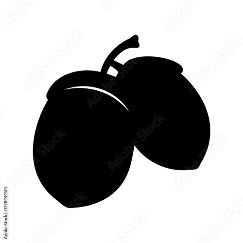 Two acorns in stark black silhouette on a crisp white background