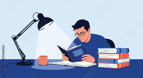 A focused young man with glasses reads a book at a desk, illuminated by a desk lamp, with a steaming mug and a stack of books.