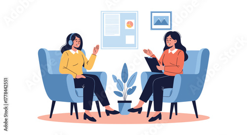 Two women engage in a supportive conversation, possibly a therapy session or counselling, seated comfortably in a professional setting.
