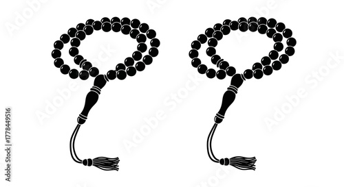 Two black prayer beads with tassels displayed in a simple monochrome style