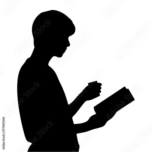 silhouette of a person reading a book