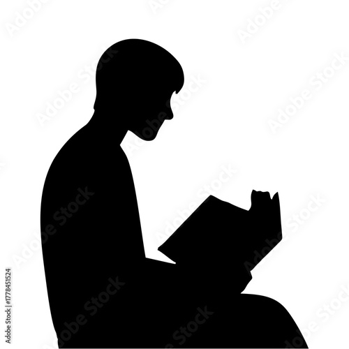 silhouette of a person reading a book