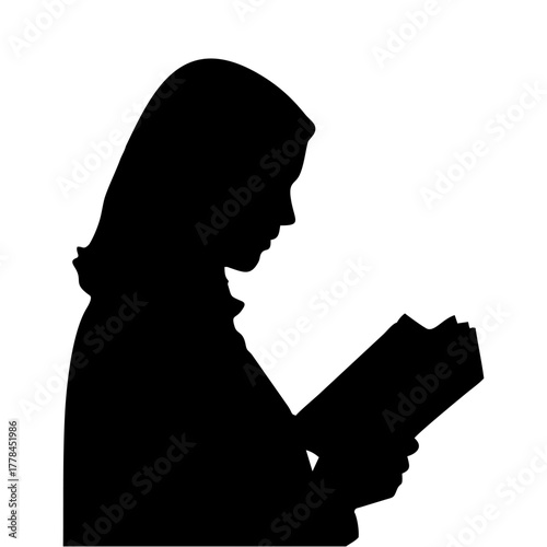 silhouette of a person reading a book