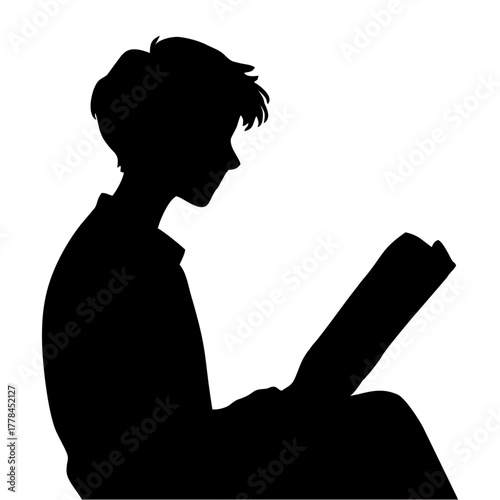 silhouette of a person reading a book