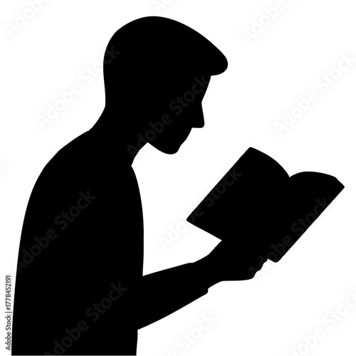 silhouette of a person reading a book