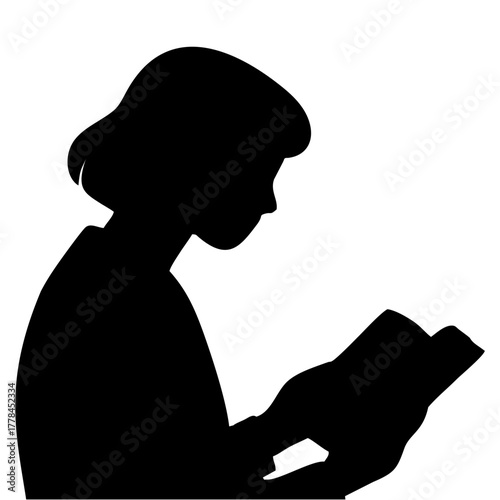silhouette of a person reading a book
