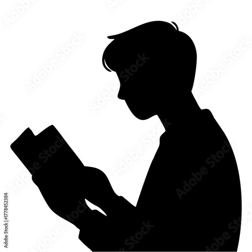 silhouette of a person reading a book