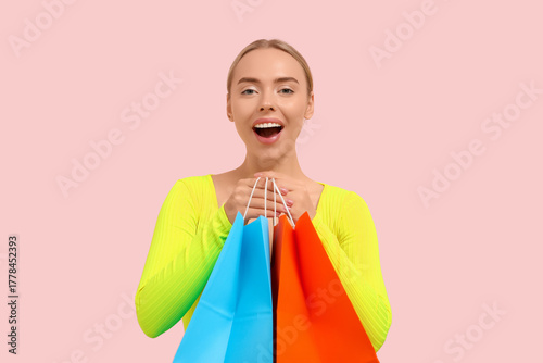 Happy young woman with shop...