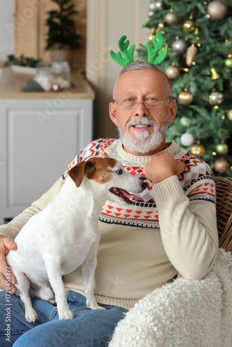 Mature man with cute dog in...
