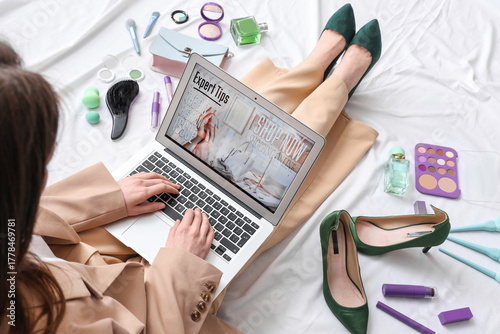 Young woman with laptop, ma...