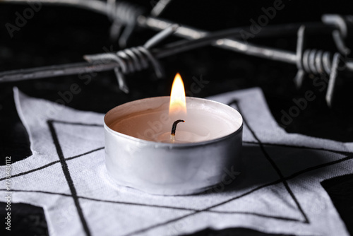 Burning candle with Jewish ...