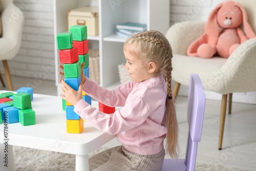 Cute little girl with plast...