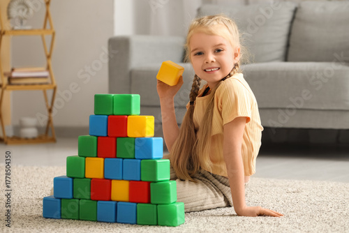 Cute little girl with plast...