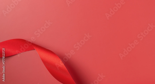 Red ribbon color curly scroll isolated on background