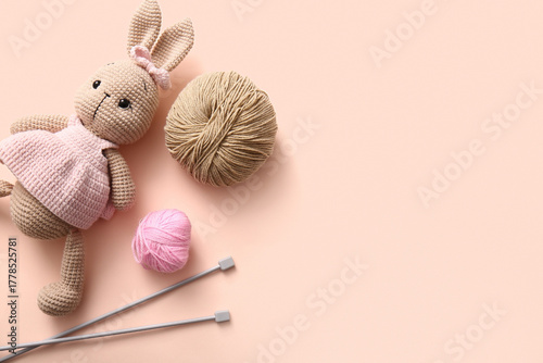 Knitted bunny toy with yarn...