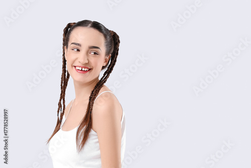 Happy young woman with brai...