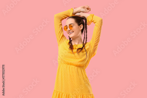 Happy young woman with brai...