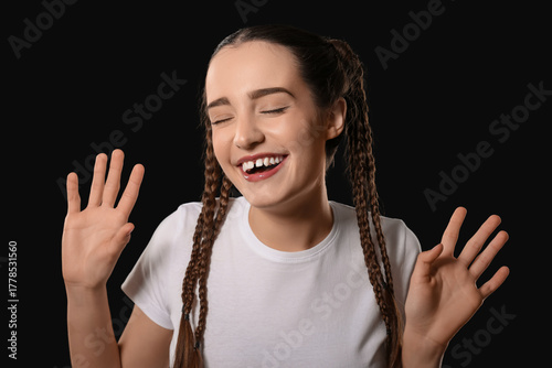 Happy young woman with brai...