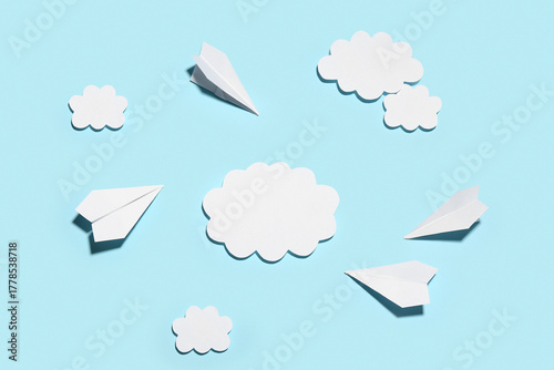 Paper planes with clouds on...