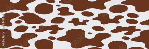 Cow print seamless pattern. Abstract cow skin pattern ideal for textile design, backgrounds, wallpapers, or creative branding with organic shapes.

