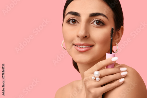 Pretty young woman with mas...