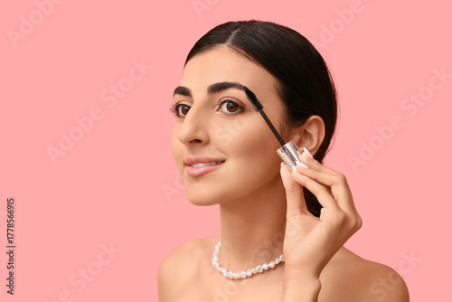 Pretty young woman applying...