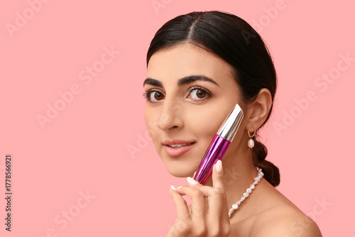 Pretty young woman with mas...