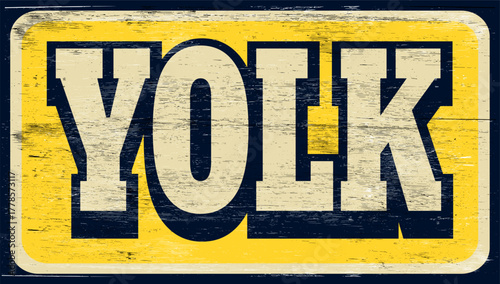 Aged retro yolk sign on wood