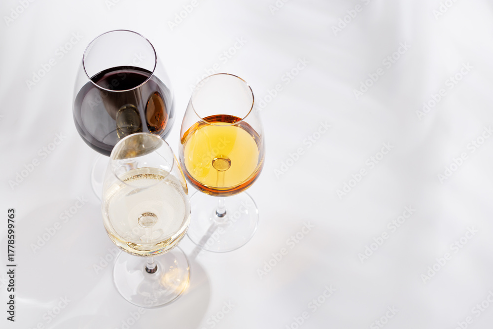 Fototapeta premium Different wine glasses on white background