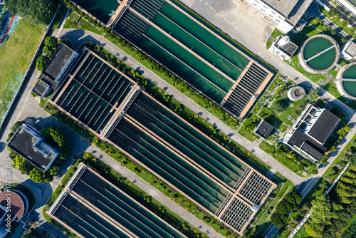 Aerial view of water treatment plant with large sedimentation tanks