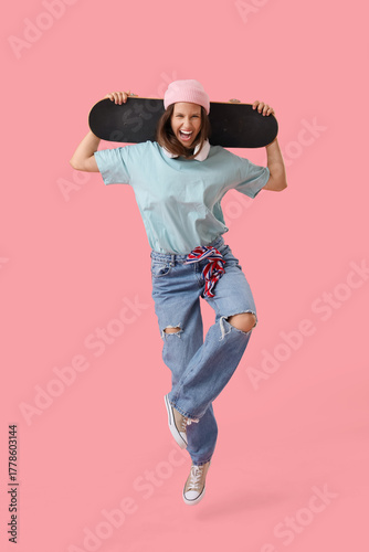 Happy young woman with skat...
