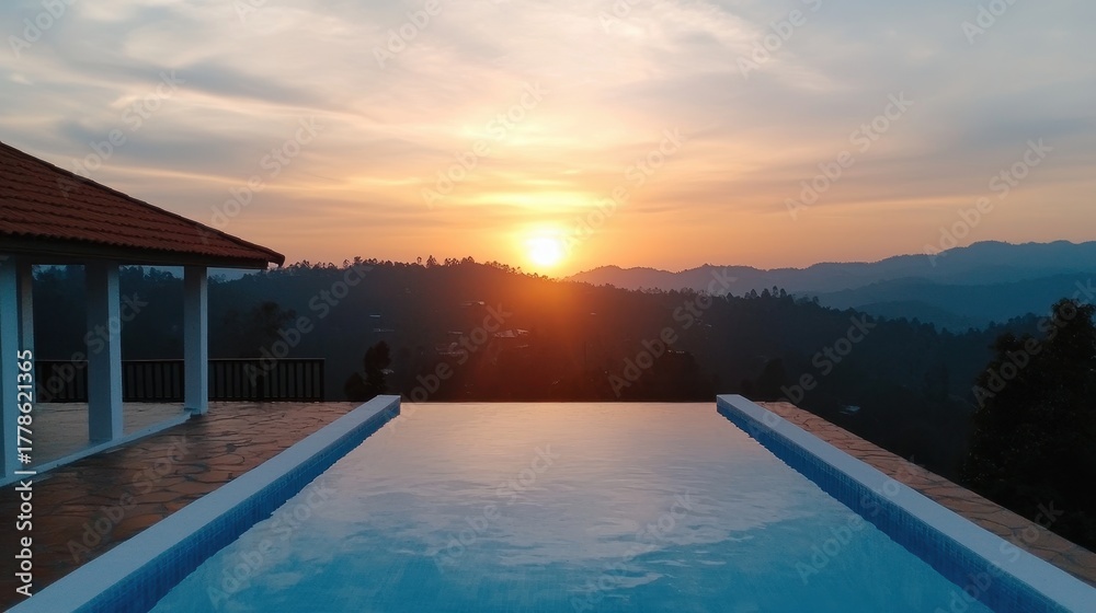 Fototapeta premium Wellness fitness holistic concept. A serene sunset view over a hillside pool.