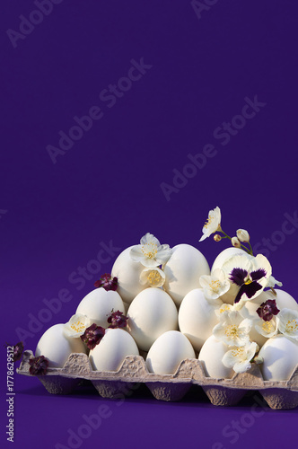 Flowered white eggs on purple backdrop