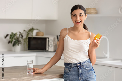 Young woman with vitamin E ...