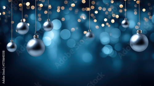 Christmas holiday background with copy space, hanging balls and bokeh lights on blue background. Merry Christmas and Happy Holidays greeting card, frame, and banner. New Year. Noel