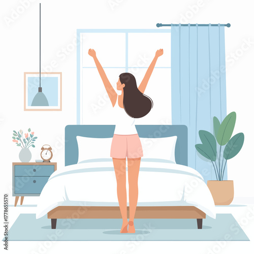 Energetic young woman stretching her arms up, seen from behind, wearing comfortable sleepwear.