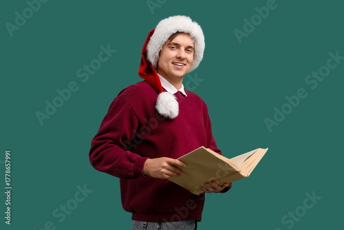 Young man in Santa hat read...