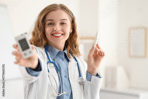 Female doctor with glucomet...