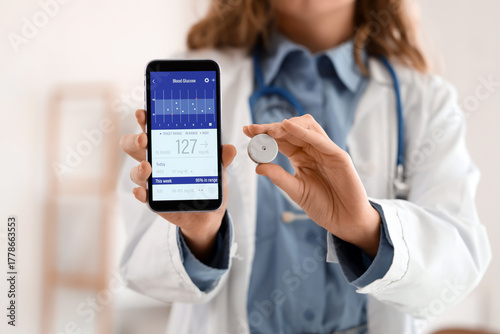 Female doctor with mobile p...