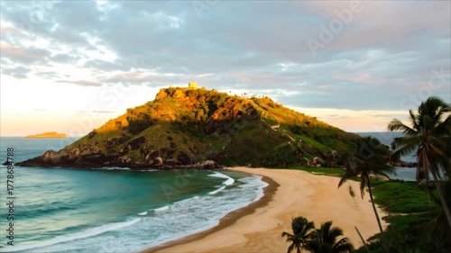 Stunning Sunrise over Secluded Tropical Beach and Hilltop Fortress