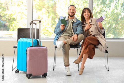 Young couple with passports...