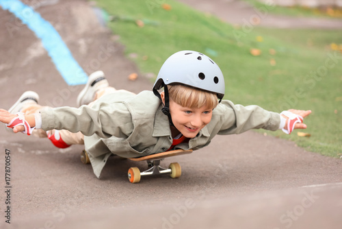 Little boy with helmet ridi...