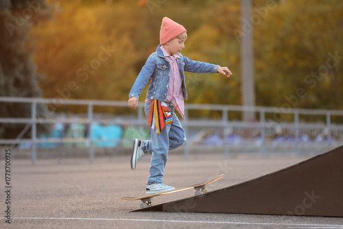 Cool little boy riding skat...