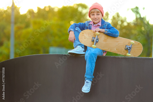Cool little boy with skateb...