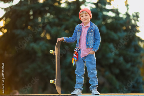 Cool little boy with skateb...