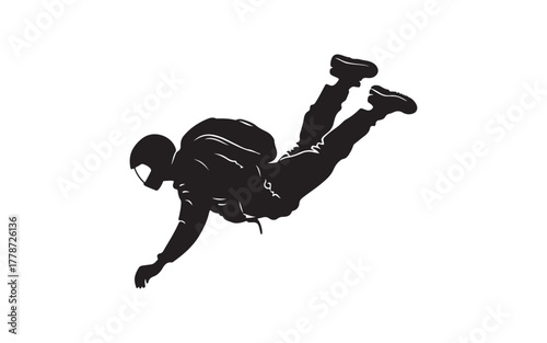 silhouette of a man jumping and parachute