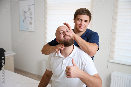 Chiropractor adjusting patient's neck in medical clinic. Professional manual therapy, spine alignment, and rehabilitation treatment for pain relief and wellness.