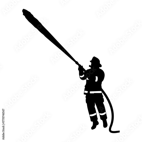 Firefighter spraying water hose fire hose action