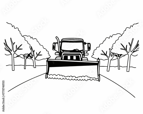 Snowplow clearing a road lined with trees in winter