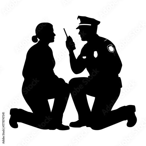 Officer kneeling speaking to civilian police officer